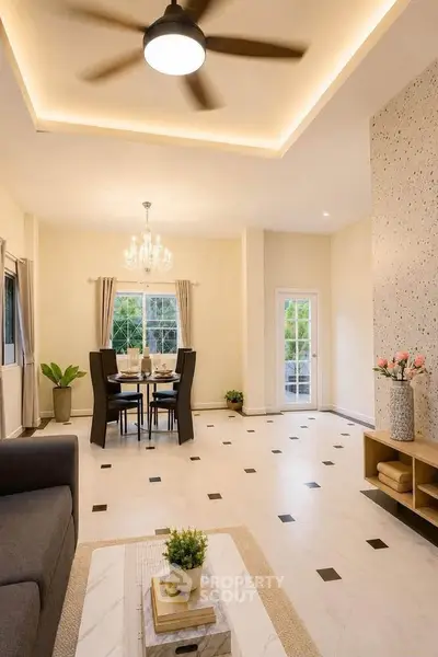 Spacious living room with elegant dining area and modern decor