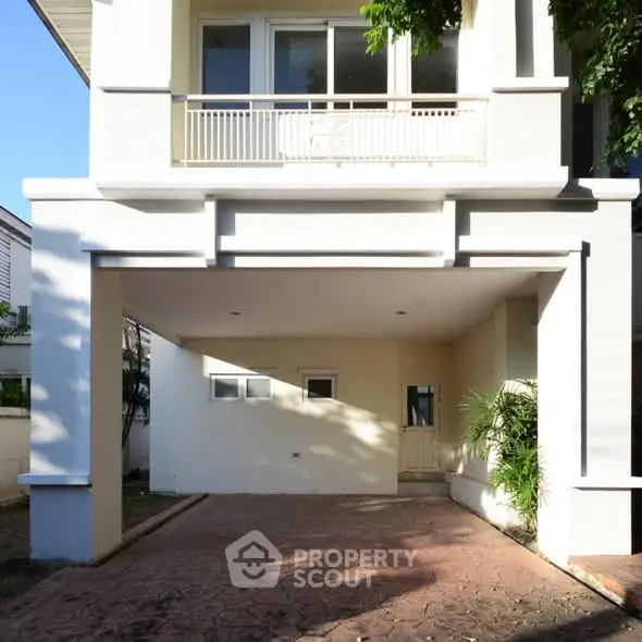 Charming two-story home with spacious driveway and balcony in a serene neighborhood.