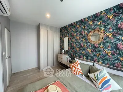 Stylish bedroom with vibrant tropical wallpaper and modern decor