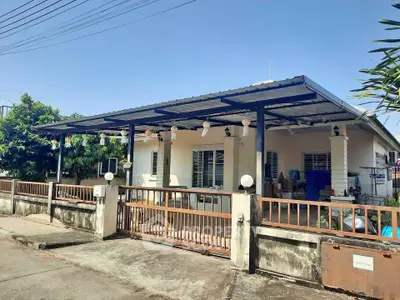 Charming single-story home with spacious covered patio and gated entrance, perfect for family living.