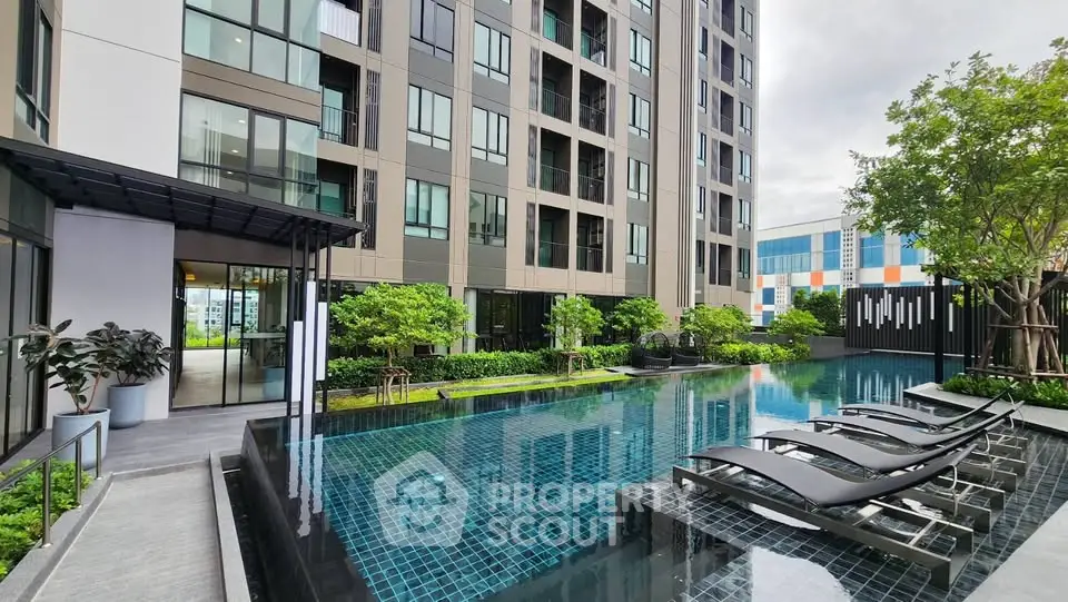 Modern apartment building with luxurious pool and lush greenery, perfect for urban living.