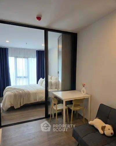 Cozy modern bedroom with glass partition and stylish decor