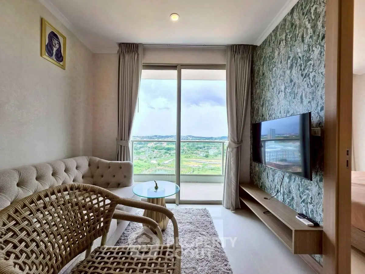 Chic living room with modern decor and stunning balcony view