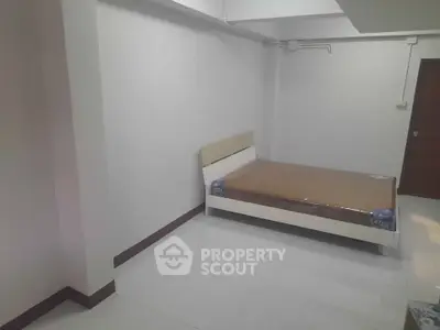 Spacious bedroom with modern bed and minimalist design