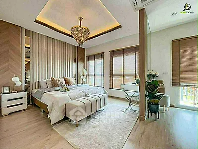 Luxurious bedroom with elegant chandelier and large windows offering natural light