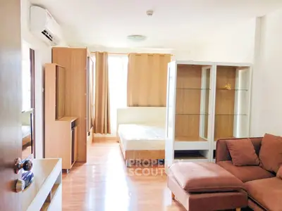 Bright and cozy studio apartment with modern furnishings and natural light.