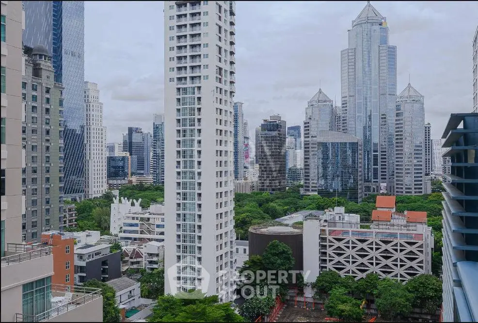 Stunning cityscape view showcasing modern skyscrapers and lush greenery, perfect for urban living enthusiasts.
