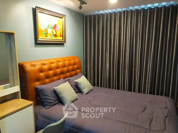 Cozy bedroom with modern decor and plush bedding