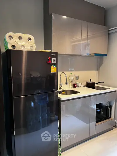 Modern kitchen with sleek cabinets and stainless steel appliances