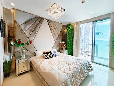 Luxurious bedroom with stunning ocean view and elegant decor