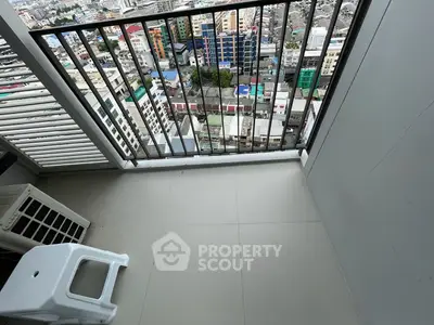 High-rise balcony with cityscape view, perfect for urban living enthusiasts.