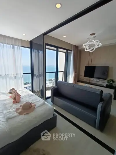 Luxurious beachfront apartment with stunning ocean view and elegant interior design.