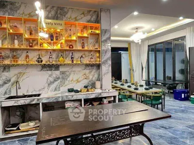 Luxurious villa interior with elegant dining area and stylish bar setup, perfect for entertaining guests.