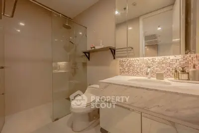 Modern bathroom with glass shower and marble countertop