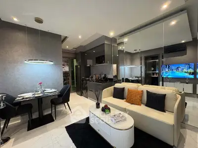 Luxurious modern living room with open kitchen and elegant dining area