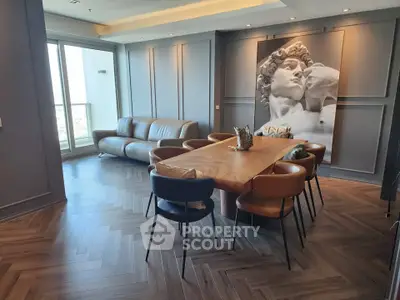 Luxurious modern living room with elegant dining area and stunning wall art, featuring sleek furniture and large windows.