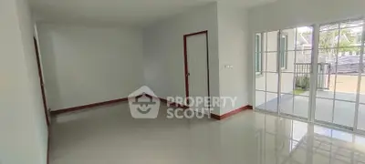 Spacious empty room with large windows and glossy floor tiles