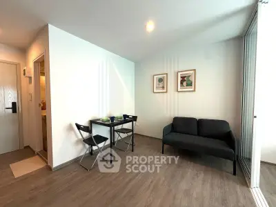 Modern living room with sleek furniture and stylish decor in a contemporary apartment.