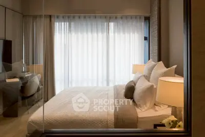 Luxurious bedroom with elegant decor and soft lighting, featuring a cozy bed and stylish furnishings.