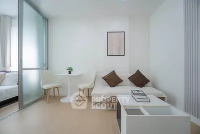 Modern minimalist living room with cozy seating and stylish decor