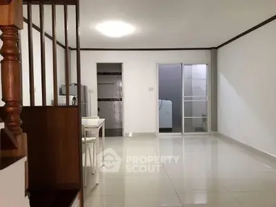 Spacious open-plan living area with modern design and ample natural light.