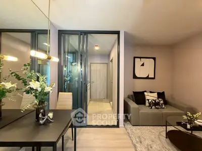 Modern living room with stylish decor and glass partition