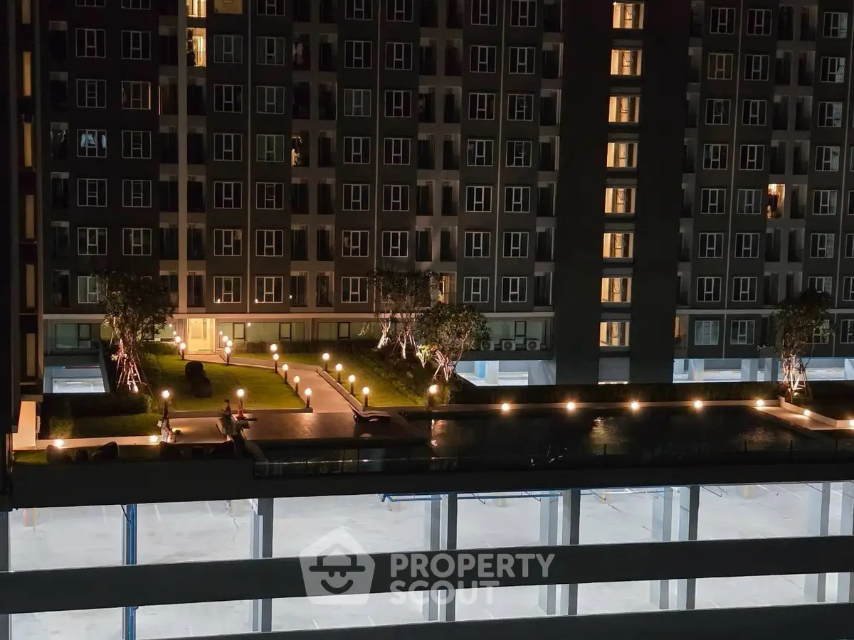 Stunning night view of modern apartment building with illuminated garden terrace.