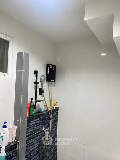 Modern bathroom with sleek shower design and tiled walls
