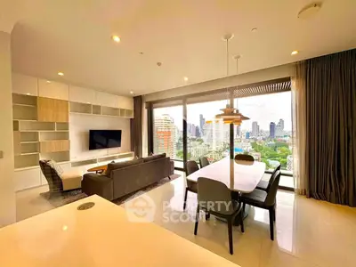Luxurious living room with stunning city view, modern furniture, and elegant dining area in high-rise apartment.