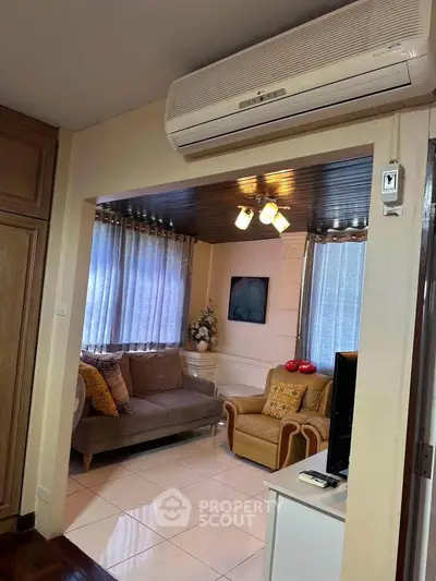 Cozy living room with air conditioning and stylish decor