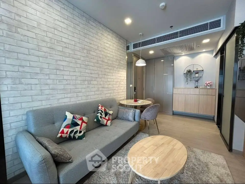 Modern living room with stylish decor and open kitchen layout