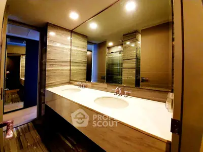 Luxurious modern bathroom with dual sinks and elegant lighting