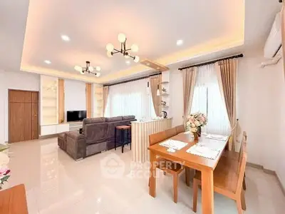 Spacious modern living room with elegant dining area and stylish lighting.