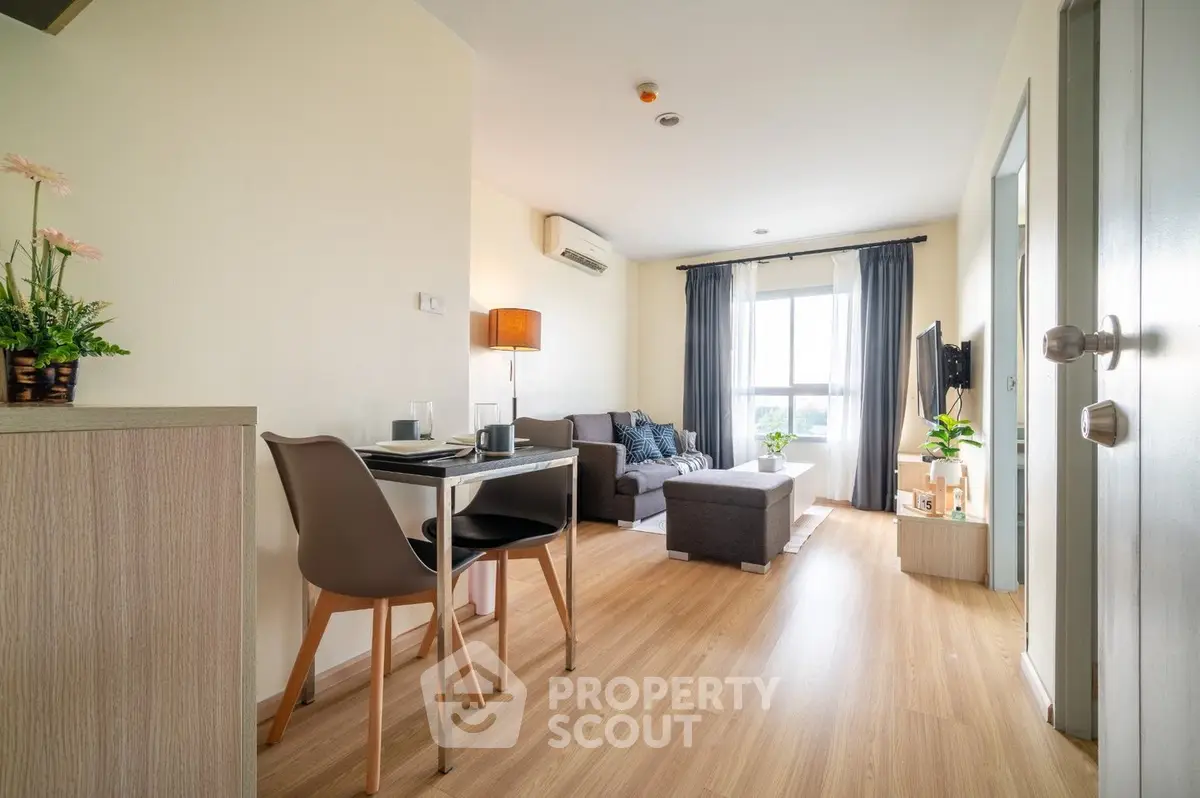 Bright and airy modern living space with sleek furniture and ample natural light, perfect for urban living.