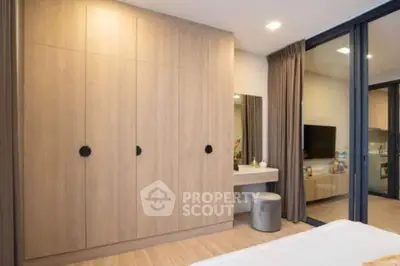 Modern bedroom with built-in wardrobe and cozy decor