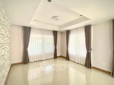 Spacious empty living room with elegant curtains and modern ceiling design