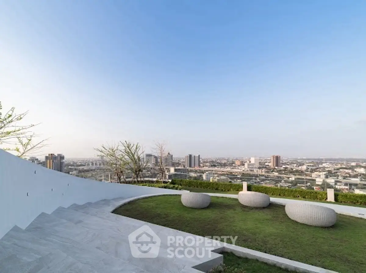 Stunning rooftop garden with panoramic city views and modern seating.
