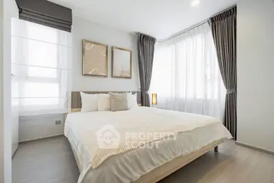 Bright and airy bedroom with modern decor and large windows