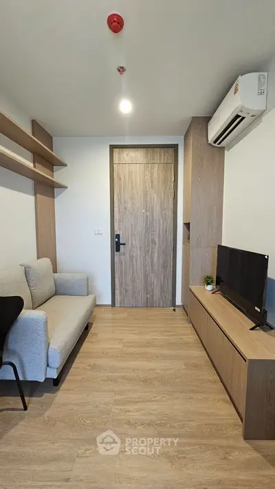 Modern living room with sleek furniture and air conditioning