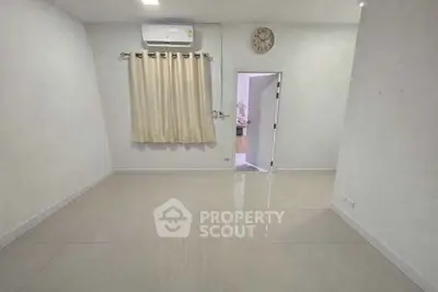 Spacious empty room with air conditioning and tiled floor, perfect for customization.