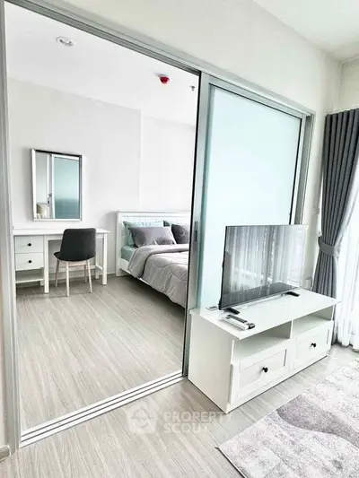 Modern bedroom with sliding glass doors and stylish decor