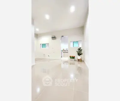 Spacious modern interior with glossy tile flooring and minimalist decor