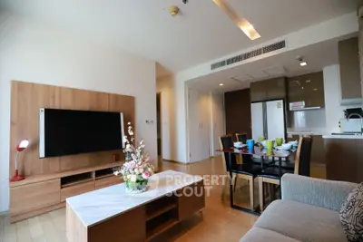 Modern living room with stylish decor and open kitchen layout in a contemporary apartment.