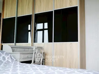 Spacious bedroom with elegant wardrobe and stylish furniture