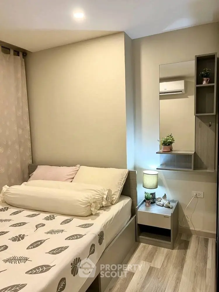 Cozy bedroom with modern decor and soft lighting, perfect for relaxation.