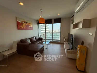 Modern living room with city view, leather sofa, and stylish decor