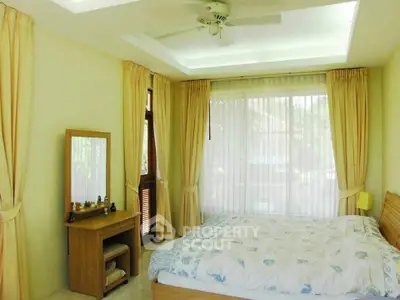 Bright and airy bedroom with large windows and elegant decor