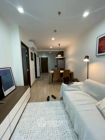 Modern living room with cozy dining area and stylish decor