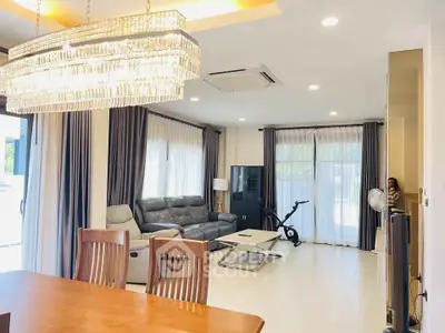 Spacious living room with elegant chandelier and modern furniture