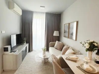 Stylish modern living room with elegant decor and dining area, featuring a cozy sofa and large window.